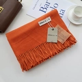 Folded orange cashmere-like scarf with fringe and branding tags on a white background - Orange / 200cm