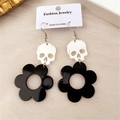 Gothic skull earrings with black flower charms and silver hooks on fashion jewelry card - Flower Skull