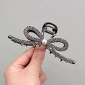 Elegant gunmetal alloy bow hair claw clip with rhinestones and a white pearl accent - Elegant Ribbon Gun Black