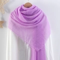 Purple wrinkled cotton linen scarf with frayed edges styled on a white shirt and hanger - Purple