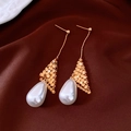 Detail of 18k gold plated mesh drops with elegant white water drop pearls on brown silk - Gold