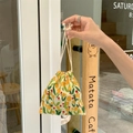 Corduroy drawstring makeup bag with yellow tulip pattern held in hand for storage - Tulip Yellow Branch