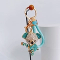 Detailed view of koala keychain with rhinestones, gold plating and braided strap - Blue with Heart Lanyard / Blue