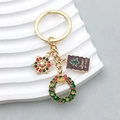 Porte-clés de Noël doré avec pendentif flocon, couronne et breloques Merry X-mas - Style Flocon Couronne Étiquette de Noël (ER814)