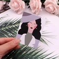 Stud earrings on illustrated card featuring a stylish woman in purple and black curls - 6x8cm / Goddess Series No.6