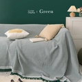 Green waffle weave sofa cover blanket with decorative fringe in a cozy home setting - 90*90cm / Green