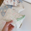 Detail of assorted mini cotton pouches featuring cute animal prints and colorful zipper pulls - Pink Green Floral
