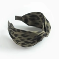 Green leopard print fabric headband with decorative top knot on white background - Green Leopard Print