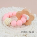 Pink silicone and beech wood flower teething bracelet for babies weighing 32.5g - Flower/Pink Beads