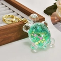 Green liquid oil turtle keychain with sparkling sequins and gold metal keyring detail - Sparkling Green