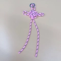 Pink hand-woven knot keychain with black spiral details and a polished metal ring - Pink