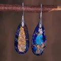Detail view of teardrop natural emperor stone earrings on a rustic wood branch - Dark Blue Marble Texture Style (ER1025-14)