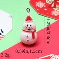 Detailed view of resin snowman charm with red hat and dimensions 1.29in x 0.59in - 46# Glitter White Snowman