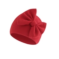 Close-up of baby turban hat featuring red knitted fabric and a large bow detail - Bright Red (Bow Turban Hat)