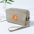 Khaki waterproof nylon triple-zipper clutch with wrist strap and orange logo - Medium / Khaki (Yellow Label)