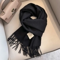 Classic black 100% Australian wool scarf featuring elegant fringe and woven label detail - Black