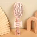 Spazzola massaggiante rosa con cuscino d'aria e supporto coordinato per capelli donna - Rosa