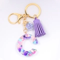 Letter C resin keychain with colorful stones, purple tassel, and star charm - Letter C