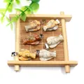 Natural carved gemstone angel pendants with silver clasp in various earthy tones - Crazy Agate