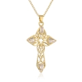 Gros plan d'un collier croix creuse plaqué or 18K avec pierres de zircon rectangulaires - Croix évidée dorée avec zircone blanc