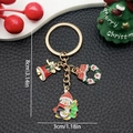 Cute KC gold Christmas keychain with enamel penguin, festive wreath, and small bell charm - ER819-Enamel Penguin Holding Tree Wreath Bell Keychain