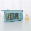 Light blue mesh travel toiletry bag with zipper and hand strap for storage - Blue