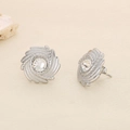 Detail of silver spiral stud earrings with sparkling round zircon on beige background - Steel Spiral Texture Zircon Style (KE116424-KFC)