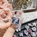 Detailed close-up of a luxury pink gemstone ring with star motifs and cascading stones - Style 0429-Black Square With Pink Waterfall