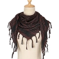 Close-up of black and brown houndstooth pattern scarf with delicate fringe details - Coffee