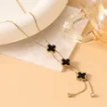 Detail of 18K gold snake chain necklace with black clover charms and crystal tail - Black Clover (Gold Style 5)