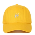 Close-up of premium yellow cotton baseball cap with thick white 3D letter H embroidery - Yellow