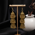 Detail of vintage gold-tone triple-layer Jhumka earrings with bells on a stand - H4185-1 Antique Gold