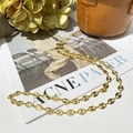 Elegant gold pig nose coffee bean chain necklace displayed on luxury lifestyle props - Single Layer Gold Coffee Bean Chain