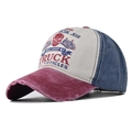 Close-up of a distressed cotton baseball cap with worn brim and tri-color block design - Adjustable / Wine Red & Navy