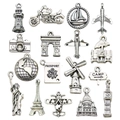 Set of 16 silver metal travel charms featuring Eiffel Tower, plane and passport designs - 17pcs Mixed Antique Silver Travel Set