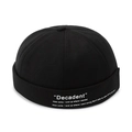 Retro black docker cap with white minimalist embroidery and lettered brim detail - Adjustable / Black