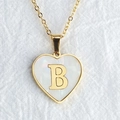 Golden heart necklace with shell inlay and letter B pendant on white fabric - Letter B / Gold