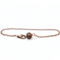 Detail of bronze metal pendulum chain featuring a hollow sphere charm and lobster clasp - Bronze Hollow Chain