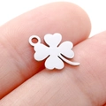 Delicate silver clover leaf pendant made of stainless steel displayed on a fingertip - DY743 Four-Leaf Clover / Steel