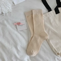 Classic ribbed crew socks in beige cotton blend on minimalist aesthetic background - One Size / Beige