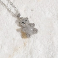 Detailed silver teddy bear pendant necklace with sparkling zircon and heart-shaped crystals - Silver / White Zirconia