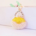 Creative handbag keychain with gold metal, rainbow rhinestones and white pearls pendant - Yellow