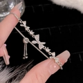 Macro detail of silver-tone bow bracelet with sparkling zircons and adjustable drawstring - S248 Silver