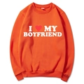 Bright orange crewneck sweatshirt featuring I Love My Boyfriend print and heart graphic - Orange Slogan