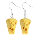 Quirky yellow acrylic cheese slice drop earrings with silver hooks on white background - Cheese