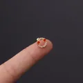 Golden cartilage earring with white crystals and red stars on a finger tip - Red Star Diamond Circle Style (HSPJ356-6#G)