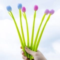 Handheld tulip flower pens in blue, pink, and purple colors against a clear blue sky background - Random Styles / 0.5mm