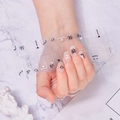 Macro detail of high-quality black and white line art nail stickers with heart and planet motifs - Black White Line Art Symbol Style (SS-044)