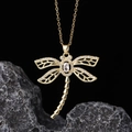 Macro detail of gold dragonfly pendant with pave-set crystals on rough stone background - Style I-Gold Hollow Prong Set Main Stone