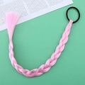 Detailed view of a pink braided hair extension with a black elastic tie on green backdrop - Pink